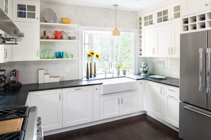 white kitchen cabinets with dark countertop