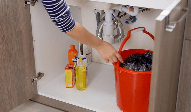 taking out the trash to clean kitchen