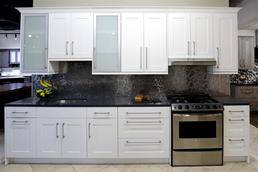 white shaker cabinets with black countertops