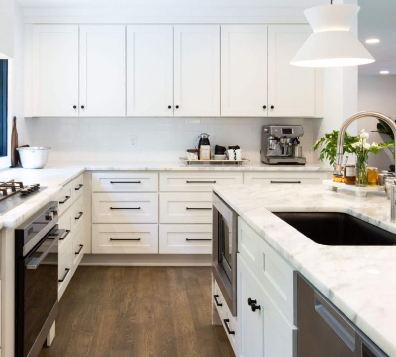 all white shaker cabinets, countertops and backsplash