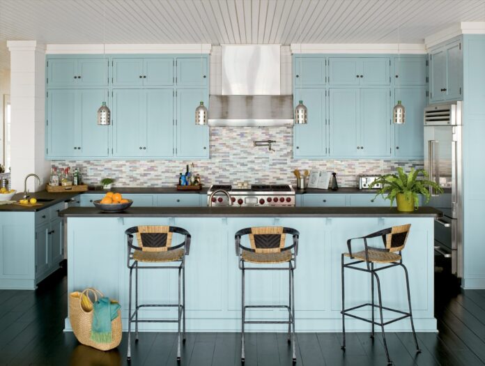 soft teal blue shaker cabinets for a coastal kitchen design