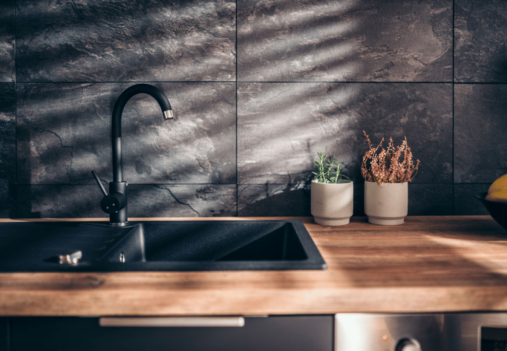 modern kitchen with black sink and faucet