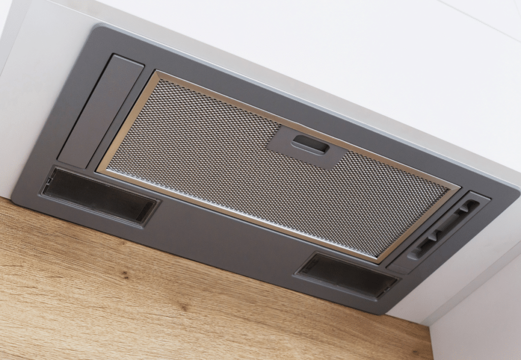 gray range hood in a modern kitchen