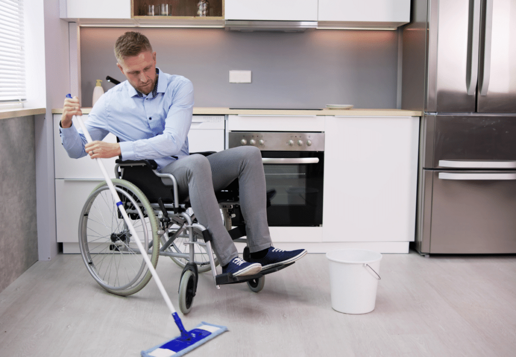 Person with Disability Cleaning the Kitchen Floor - Best Online Cabinets person with disability cleaning the kitchen floor